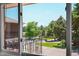 Exterior view seen from inside shows well-kept landscaping with mature trees at 2682 S Benton St, Lakewood, CO 80227