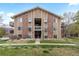 Well-maintained condo building with attractive landscaping and visible entryways at 3021 S Ursula Cir # 102, Aurora, CO 80014
