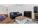 Welcoming living area with fireplace, plush seating, and stylish decor at 3021 S Ursula Cir # 102, Aurora, CO 80014
