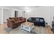 Comfortable living room features plush sofas, stylish coffee table, and neutral wall color at 3021 S Ursula Cir # 102, Aurora, CO 80014