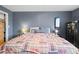 Cozy primary bedroom featuring comfortable bedding, a safe, and neutral decor at 3021 S Ursula Cir # 102, Aurora, CO 80014