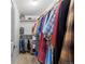 Spacious walk-in closet with ample hanging space and shelving for storage at 3021 S Ursula Cir # 102, Aurora, CO 80014