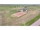 Aerial view of the property with a barn, training area, and large grassy areas at 7600 Patrick Trl, Elizabeth, CO 80107
