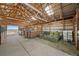 Spacious barn interior featuring horse stalls, hay storage, and an open layout, perfect for equestrian enthusiasts at 7600 Patrick Trl, Elizabeth, CO 80107
