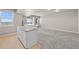Open concept basement area with bar, ample seating, and natural light at 7600 Patrick Trl, Elizabeth, CO 80107