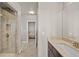 Elegant bathroom with walk-in shower, granite counters, and doorway to bedroom at 7600 Patrick Trl, Elizabeth, CO 80107
