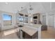 Spacious kitchen island complements an open floorplan with granite countertops and views of the fireplace at 7600 Patrick Trl, Elizabeth, CO 80107