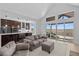 Open concept living area showcasing the kitchen, seating, and an outdoor view from the sliding door at 7600 Patrick Trl, Elizabeth, CO 80107