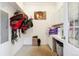 Tack room featuring white cabinets, a workbench, and a door to the outside at 7600 Patrick Trl, Elizabeth, CO 80107