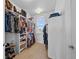 Spacious walk-in closet with custom shelving and natural light at 7600 Patrick Trl, Elizabeth, CO 80107