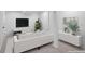 Staged basement living room with a neutral color scheme, comfortable seating, and sleek decor at 1325 S Grape St, Denver, CO 80222