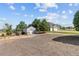 Large backyard showing house, driveway, shed, and open space at 9576 E 147Th Pl, Brighton, CO 80602