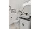 Bathroom features a modern vanity, vessel sink, decorative mirror and adjacent toilet at 9576 E 147Th Pl, Brighton, CO 80602