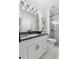 Bathroom featuring a vanity, framed mirror, glass enclosed shower and tiled floors at 9576 E 147Th Pl, Brighton, CO 80602