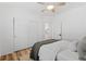 Bedroom features a ceiling fan, closet with sliding doors, and a neutral color palette at 9576 E 147Th Pl, Brighton, CO 80602