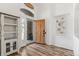 Inviting foyer with wood-look floors, decorative shelving, and stylish decor at 9576 E 147Th Pl, Brighton, CO 80602