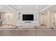 Relaxing living room featuring a large built-in entertainment center and comfortable seating at 9576 E 147Th Pl, Brighton, CO 80602