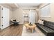 Comfortable sitting area with a barn door entry to the adjacent bathroom at 9576 E 147Th Pl, Brighton, CO 80602