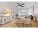 Spacious main bedroom with a ceiling fan, wood floors, and lots of natural light at 9576 E 147Th Pl, Brighton, CO 80602