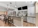 This finished basement features a wet bar with stainless appliances and a wine rack at 9576 E 147Th Pl, Brighton, CO 80602