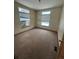 Bedroom with carpet and two windows at 10871 Kitty Dr, Conifer, CO 80433