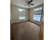 Bright bedroom with carpet and ceiling fan at 10871 Kitty Dr, Conifer, CO 80433