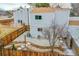 Aerial view of back yard featuring landscaping, patio, and wood fence at 16349 E Radcliff Pl # B, Aurora, CO 80015