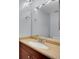 Bathroom featuring a light brown granite vanity and white bowl sink with silver faucet at 16349 E Radcliff Pl # B, Aurora, CO 80015