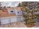 Charming townhome featuring a garage and a well-manicured lawn at 16349 E Radcliff Pl # B, Aurora, CO 80015