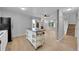 Bright, open-concept living room featuring a kitchen island and fireplace at 16349 E Radcliff Pl # B, Aurora, CO 80015