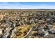 Wide aerial view of a residential community featuring tree-lined streets and a variety of home styles at 16118 Peregrine Dr, Parker, CO 80134