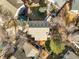 Birds eye view of the home showing the roof, backyard, patio, and mature trees surrounding the property at 16118 Peregrine Dr, Parker, CO 80134