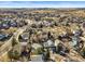 Full aerial shot of a residential neighborhood featuring tree-lined streets and various home styles at 16118 Peregrine Dr, Parker, CO 80134