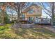 Inviting backyard with multi-level deck, stone retaining wall and mature trees at 16118 Peregrine Dr, Parker, CO 80134