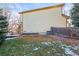 Exterior shot of a home's backyard with a deck and lush lawn at 16118 Peregrine Dr, Parker, CO 80134