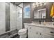 Bathroom featuring a glass enclosed shower with gray tile and granite countertops at 16118 Peregrine Dr, Parker, CO 80134