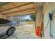 Garage featuring an electric car charger and an open garage door at 16118 Peregrine Dr, Parker, CO 80134