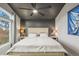 Relaxing bedroom with large window, ceiling fan, and unique accent wall at 16118 Peregrine Dr, Parker, CO 80134