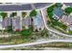 An aerial view showing the house with a well-maintained lawn, landscaping, and a nearby greenway and walking path at 11837 Meadowood Ln, Parker, CO 80138