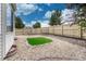 Fenced backyard with gravel and small patch of grass offers a low maintenance yard at 11837 Meadowood Ln, Parker, CO 80138