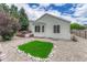 Landscaped backyard with gravel, decorative stone, and built in grill at 11837 Meadowood Ln, Parker, CO 80138