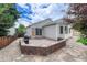 Backyard space offers a stone patio and a built in grill space at 11837 Meadowood Ln, Parker, CO 80138