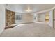 Finished basement featuring a stone fireplace and neutral carpet at 11837 Meadowood Ln, Parker, CO 80138