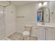 Bathroom with tiled floor, and white wainscotting. Includes vanity, toilet and shower at 11837 Meadowood Ln, Parker, CO 80138