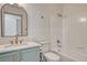 Charming bathroom features a vanity with gold fixtures and a shower-tub combination at 11837 Meadowood Ln, Parker, CO 80138