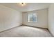 Bedroom with neutral carpet and good natural light from the basement window at 11837 Meadowood Ln, Parker, CO 80138