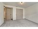 Neutral bedroom featuring carpeted floors, closet space, and fresh paint at 11837 Meadowood Ln, Parker, CO 80138
