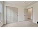 Spacious bedroom features neutral carpet, white doors, and a closet with ample storage at 11837 Meadowood Ln, Parker, CO 80138