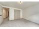 Bedroom with neutral carpet, and closet, plus basement access at 11837 Meadowood Ln, Parker, CO 80138