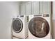 Laundry room with large washer and dryer for efficient convenience at 11837 Meadowood Ln, Parker, CO 80138